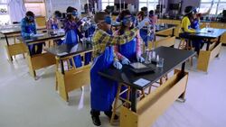 Students conduct chemistry lab experiments Stock Footage