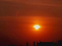 HD Timelapse:Sunset front of a temple roof.(zoom out) Stock Footage