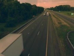 MS Shot of truck and auto traffic on interstate highway at dusk / Chelsea, Michigan, United States Stock Footage