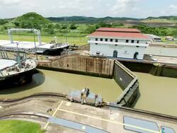 WS T/L View of ships crossing from pacific to Atlantic through miraflores locks / Panama Stock Footage