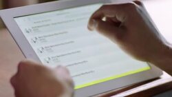 Shop employee navigates web store, chooses and books bike rental for customer Stock Footage