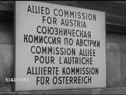 1952: ALLIED-OCCUPIED VIENNA: WS Government building, 'Allied Commission For Austria' sign in four languages, English, Russian, French, German. VS Meeting, MS Commissioner Llewellyn Thompson, MS Soviet Lieutenant-General Vladimir Sviridov (1897-1963) Instructional Video