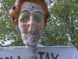 Anti-Poll Tax Protester Holding Anti-Thatcher Banner News Clip