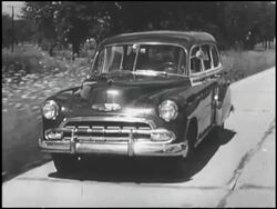 Montage: 1952 Chevrolet woodie wagon in suburb Stock Footage