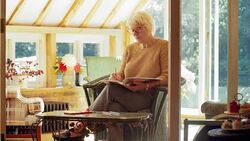 Senior woman coloring in coloring book Stock Footage