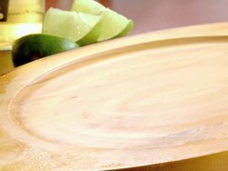 CU sizzling Fajita dish served in classic fajita pan shoved onto wooden board platter  Stock Footage