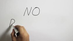 Hand writing a 'No Racism' message on a white board using a black marker Stock Footage