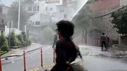 CLEAN : Honduran police disperse protest with tear gas water cannons News Clip