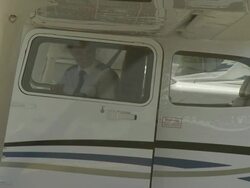 Female pilot exits Cessna 172, Australia Stock Footage