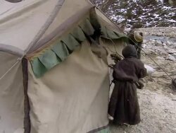 WS POV Woman bringing fire wood to camp / Himalayas, Upper Dolpo, Nepal   Stock Footage