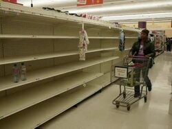 Empty bottled water shelves at a grocery store Stock Footage