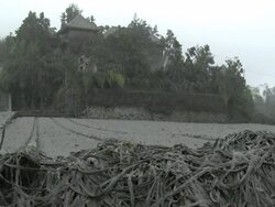 Village field coated in thick layer of volcanic ash mud after eruption of Merapi volcano; Indonesia. 7 November 2010 / AUDIO Stock Footage
