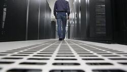 Administrator walking in the data center room Stock Footage