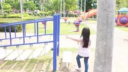 Pretty girl is playing toys in amusement park Stock Footage