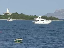 WS Alcanada lighthouse near alcandia  / Cala San Vicente, Mallorco Baleric Island, Spain Stock Footage