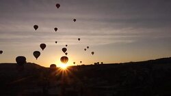 timelapse of hot air balloons in the air from within the valley in Cappadocia Stock Footage