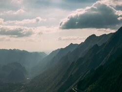 Time-lapse of clouds in the mountains Stock Footage