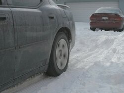 MS Car pulling out of driveway in snow Stock Footage