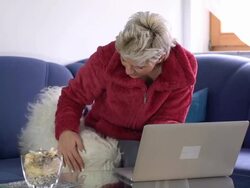 HD DOLLY: Woman Using Laptop And Cuddling A Dog Stock Footage