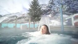 Young Asia woman enjoy hot spring in Switzerland Stock Footage