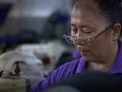 Workers at a Beijing Rontex Garment Factory News Clip
