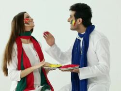 Couple playing holi with colors   Stock Footage