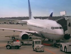 Passenger plane at the gate Stock Footage