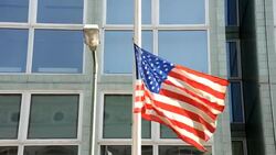CLEAN: US flag at Berlin's Checkpoint Charlie at half-mast for 9/11 News Clip