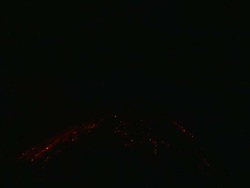 Wide shot of lava erupting and tumbling down volcano at night, Krakatoa, Indonesia, November 2010 Stock Footage