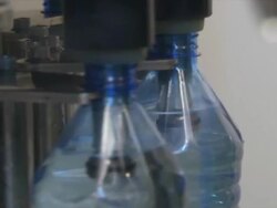CU Machine rotating full plastic water bottles, Wau, South Sudan Stock Footage