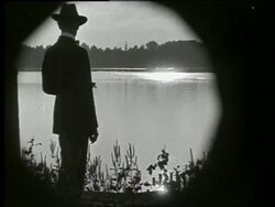 B/W rearview of man looking at Mississippi River / Vicksburg, Mississippi / NO SOUND Stock Footage