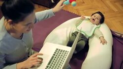 Working and parenting Stock Footage