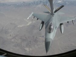 MS F-16 fighter jet refueling in mid-air, Colorado Rockies, Colorado, USA Stock Footage