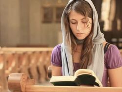 Young woman praying Stock Footage