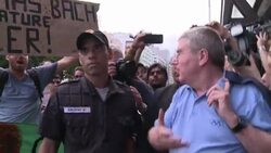 CLEAN : IOC chief faces angry protestors of olympic golf course News Clip