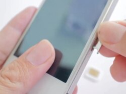 Putting sim card in smart phone Stock Footage