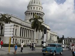 Traffic with old cars in front of Capitol building Havana Cuba Stock Footage
