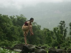 Young woman practicing yoga in the forest, Malshej Ghat, Maharashtra, India Stock Footage
