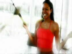 MS young woman looking in mirror pulling weights Stock Footage