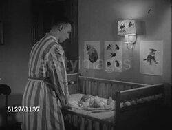 1953: NEWBORN: TWO AM: 'Walter Hobbs' walking into nursery, picking up newborn baby infant out of crib, sitting in rocker, feeding bottle.    [SOT Dr. Spock saying baby not trying to control, cries for good reason, parent wants to comfort.]... Instructional Video