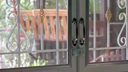 barred gate with a padlock Stock Footage