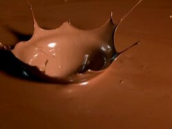 HD Super Slow-Mo: Strawberry Splashing Into Chocolate Stock Footage