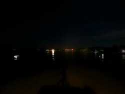 WS T/L POV View of Lightless boat navigating Mekong river at night / Mekong Delta, Cambodia Stock Footage