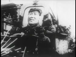 B/W 1949 troops moving thru streets with large portrait of Chairman Mao / educational Stock Footage