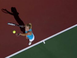 SLO MO, WS, HA, Young woman serving tennis ball, Santa Barbara, California, USA Stock Footage