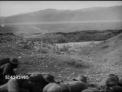 1948: POST INDO-PAKISTANI WAR: MANEUVERS: Two Pakistani tanks meet on ridge, soldiers training, on stomachs on ridge, covering movement, watching tanks moving below, crossing stream. U.N. Cease fire, Pakistan, practice, ready, Islam, Muslim. Instructional Video