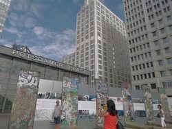 Berlin,Potsdamerplatz,TU,Tourist taking photo of Berlin Wall Stock Footage
