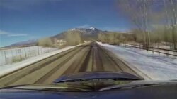 Driving Snow Covered Taos New Mexico Mountain Winter Time-lapse Sunny Day Stock Footage