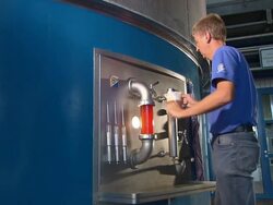 beer production, man taps beer, machine, brewery Stock Footage