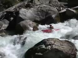 Kayaker descends extreme whitewater rapid Stock Footage